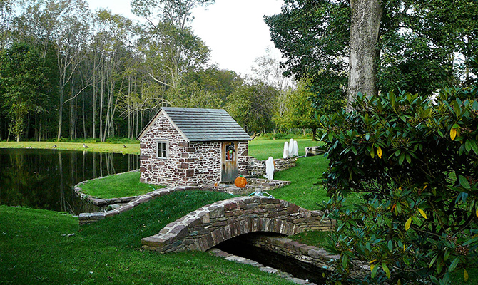 Stone springhouse and stone bridge